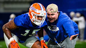 Derek Wingo and Florida assistant coach Jay Bateman in 2022.
